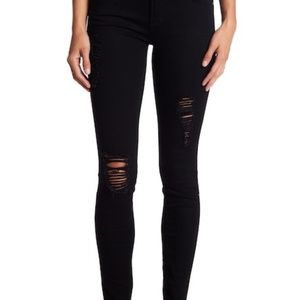 Destroyed black skinny jeans